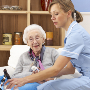 UK nurse visiting senior woman at home